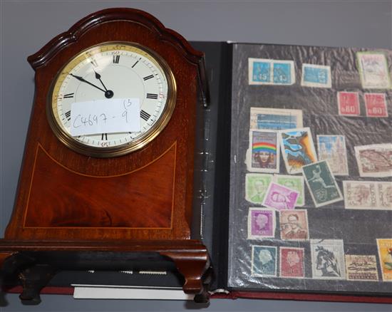 Two albums of stamps and a mantel timepiece